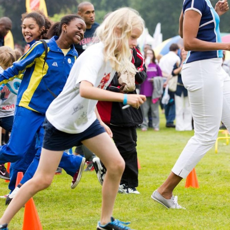 Michelle Obama Runs At An Activity Station During A “Let’S Move! London” Event At Winfield House In London, England, July 27, 2012.